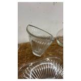 Collection of Glassware Including Bowls, Dishes, and Blue Stemmed Glasses