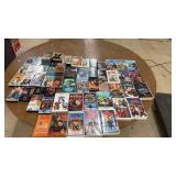 Collection of 58 Classic VHS Tapes with Family, Animation, and Action Genres