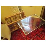 Brass tone side table with glass to...