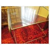 Brass tone side table with glass to...