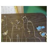 Necklaces, pendants, pins and earri...