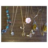 Necklaces, pendants, pins and earri...