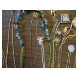 Necklaces, pendants, pins and earri...