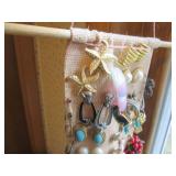 Hangable jewelry sash loaded to cap...