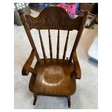 Vintage Wooden Rocking Chair with Ornate Backrest