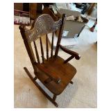 Vintage Wooden Rocking Chair with Ornate Backrest