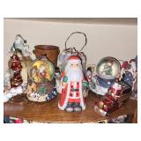 Collection of Christmas Themed Figurines and Snow Globes