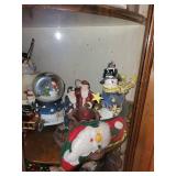 Collection of Christmas Themed Figurines and Snow Globes