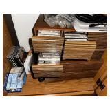 Oak Wood Cabinet with Assorted VHS Movies and Cassette Tapes