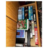 Oak Wood Cabinet with Assorted VHS Movies and Cassette Tapes