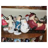 Collection of Christmas Santa Figurines and Holiday Decor