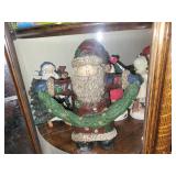 Collection of Christmas Santa Figurines and Holiday Decor