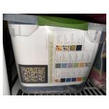 Collection of Quilting Fabrics and Supplies in Storage Totes