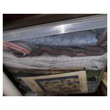 Collection of Quilting Fabrics and Supplies in Storage Totes