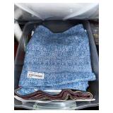 Collection of Quilting Fabrics and Supplies in Storage Totes