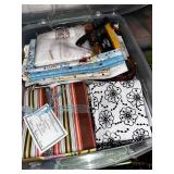 Collection of Quilting Fabrics and Supplies in Storage Totes