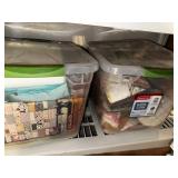 Collection of Quilting Fabrics and Patterns in Storage Bins