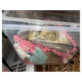 Collection of Quilting Fabrics and Patterns in Storage Bins