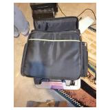 Rolling Laptop Bag with Assorted Craft Supplies and Fabrics