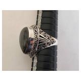 Vintage Silver Ring with Captivating Stone and Intricate Design