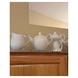 Collection of 7 White Porcelain Pitchers and Teapots