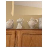 Collection of 7 White Porcelain Pitchers and Teapots