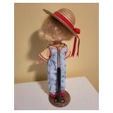 Vintage Doll with Straw Hat and Outfit on Display Stand