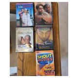 Collection of DVDs, Puzzles, and Storage Ottoman