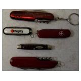 Pocket Knives - (1) Northern Plains Gunworks Red Multi Tool Pocket Knife (1) Integrity - Knife / Scissors (1) Small Swiss - Blade / scissors (1) Case - Brown Handle Pocket Knife (1) Red Multi Tool Poc