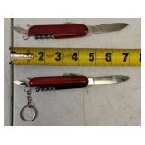 Pocket Knives - (1) Northern Plains Gunworks Red Multi Tool Pocket Knife (1) Integrity - Knife / Scissors (1) Small Swiss - Blade / scissors (1) Case - Brown Handle Pocket Knife (1) Red Multi Tool Poc
