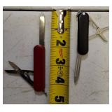 Pocket Knives - (1) Northern Plains Gunworks Red Multi Tool Pocket Knife (1) Integrity - Knife / Scissors (1) Small Swiss - Blade / scissors (1) Case - Brown Handle Pocket Knife (1) Red Multi Tool Poc