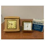 Two travel clocks