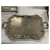 Silver plated serving tray with handles.