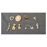 Collection of Vintage Brooches and Pins with Various Designs