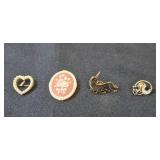 Collection of Vintage Brooches and Pins with Various Designs