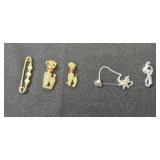 Collection of Vintage Brooches and Pins with Various Designs