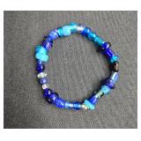 Assorted Jewelry: Gold Tone Bracelet, Gold Brooch, Beaded Bracelet, and Liz Claiborne Earrings