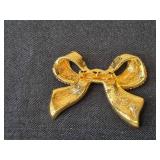 Collection of Gold-Tone and Enamel Brooch and Avon Necklaces - display not inc