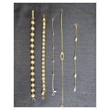Collection of Avon Gold Tone and Faux Pearl Bracelets