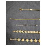 Collection of Avon Gold Tone and Faux Pearl Bracelets