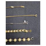 Collection of Avon Gold Tone and Faux Pearl Bracelets