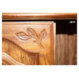 Vintage Wooden Cabinet with Intricate Carvings and Storage