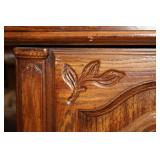 Vintage Wooden Cabinet with Intricate Carvings and Storage