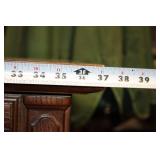 Vintage Wooden Cabinet with Intricate Carvings and Storage