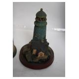 Collection of 8 Decorative Lighthouse Figurines with Varied Designs