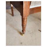 Cool ornate antique Chair with front side wheels and great detail