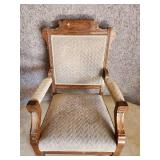 Cool ornate antique Chair with front side wheels and great detail