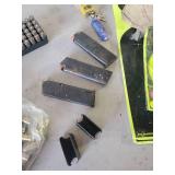 45 Auto Ammo, Targets, and Gun Clips with Some Ammo in them, and Gun Lock