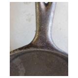Size 8 and Size 4 Cast Iron Pans one marked Lodge on the Bottom,  both in good condition