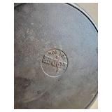 Size 8 and Size 4 Cast Iron Pans one marked Lodge on the Bottom,  both in good condition